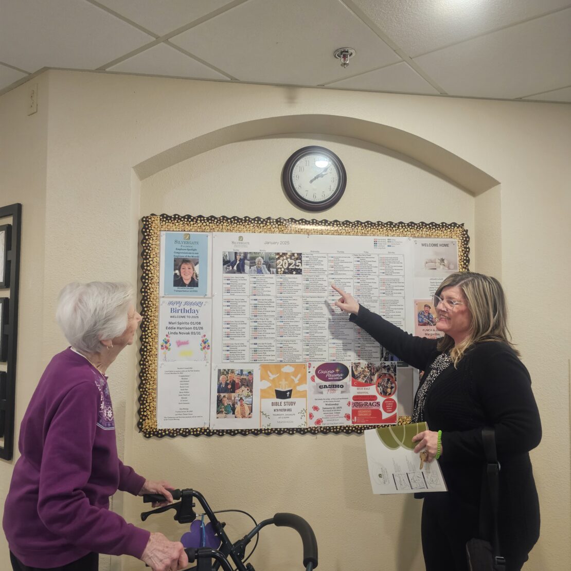 Maurene shares the monthly activity calendar with resident